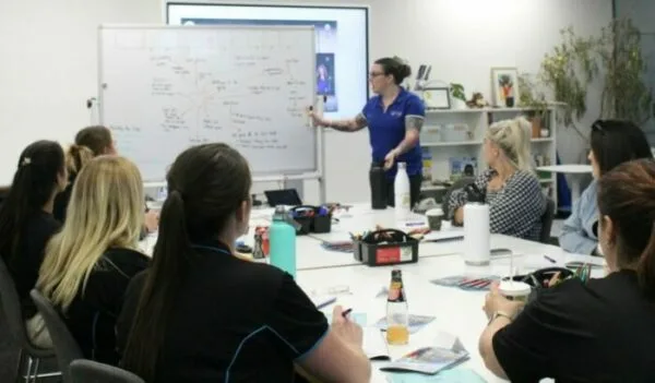 A woman teaching students about child education